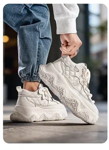 Macro detail of cream high-top platform bread sneakers with quilted leather texture.