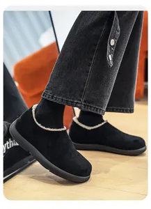 Close-up of men's black fleece-lined Birkenstock-style winter clogs with plush lining