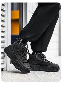 Detailed side view of black high-top leather outdoor casual boots with wavy soles