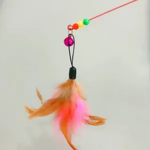 Detailed view of cat teaser replacement head featuring colorful feathers and a small pink bell