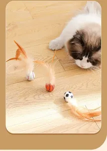 Interactive cat toy balls with long orange feathers shown with a fluffy cat on a wooden floor