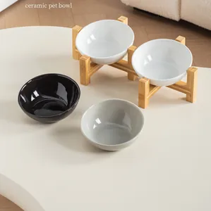 Modern slanted ceramic pet bowls with a minimalist bamboo stand in black, gray, and white