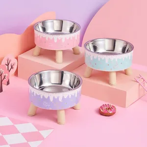 Elevated stainless steel pet bowls with cute cat illustrations for neck protection and comfort