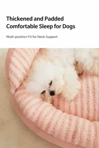 Detailed view of soft pink plush pet bed with a thick padded rim for canine neck support