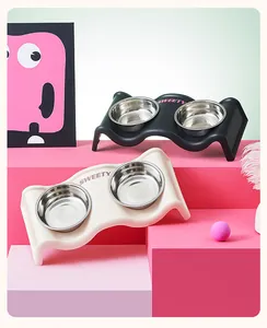 Detail of wavy elevated pet double bowls with stainless steel inserts in pink setting