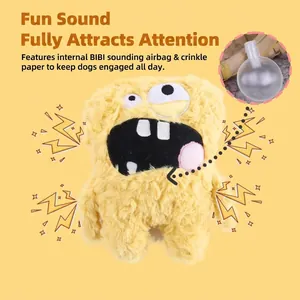 Funny monster plush dog toy with squeaker and crinkle paper on yellow background.