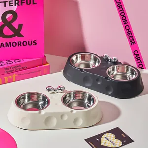 Cute cheese-shaped double pet bowl with stainless steel basins and silver bow detail