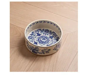 Detailed macro view of vintage blue and white floral pattern on premium ceramic pet bowl