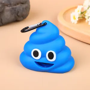 Close-up detail of a blue poop emoji-shaped dog waste bag dispenser with a black carabiner