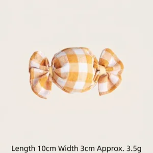 Candy-shaped cat toy with yellow gingham pattern and catnip, 10cm long.