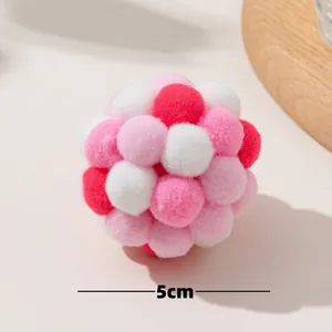 Detailed close-up view of a 5cm colorful pet cat toy pom-pom ball with soft plush texture