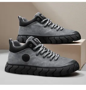 Stylish grey suede low-top sneakers featuring thick black anti-slip textured soles