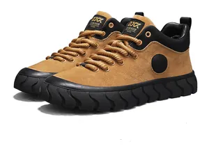 Side view of brown retro suede sneakers with thick black textured soles and round laces