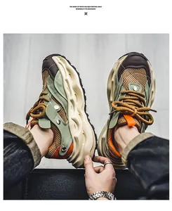 Detailed view of chunky men's sneakers featuring breathable green mesh and thick soles