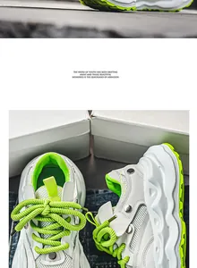 Close-up of men's chunky sneakers featuring white mesh and neon green laces