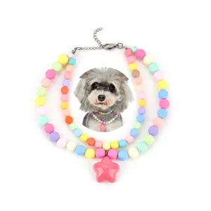 Detailed view of colorful beaded pet collar with a pink star pendant and dog model.