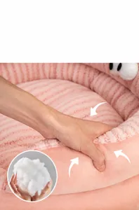 Detailed view of a plush dog bed showing the soft PP cotton filling and elastic support.
