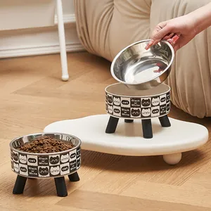 Modern elevated stainless steel cat bowl set featuring a cute black and white cat pattern stand