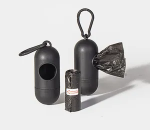 Detail view of black capsule pet waste bag dispenser with carabiner and bag roll