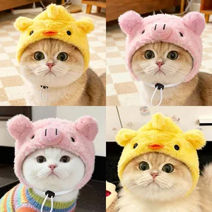 Detailed plush pet hats in cute chick and pig animal designs shown on various cats