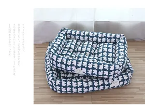 Comfortable navy blue padded pet bed with cute animal pattern for small cats and dogs