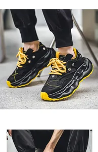 High-quality men's breathable mesh chunky dad sneakers with vibrant yellow laces and sole.