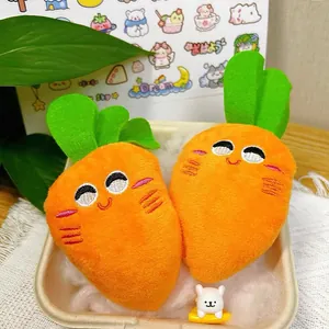 Cute plush squeaky carrot pet toy with smiling embroidered face detail for dogs