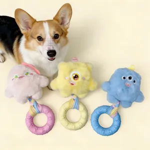 Detailed view of plush monster pet toys with rubber teething rings in various pastel colors