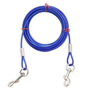 Detail showing a durable blue steel wire dog tie-out cable with heavy-duty metal snap hooks.