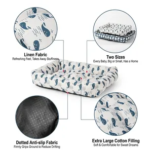 Detail showing linen whale print pet bed with anti-slip bottom and soft cotton filling.