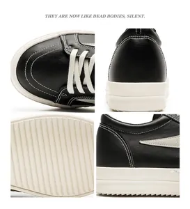 Détails de baskets montantes en cuir noir avec des surpiqûres blanches contrastées.