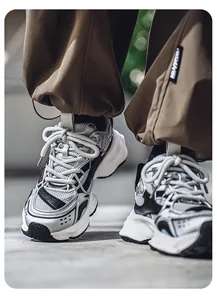 Close-up of high-quality silver and black retro chunky sneakers for men with thick soles