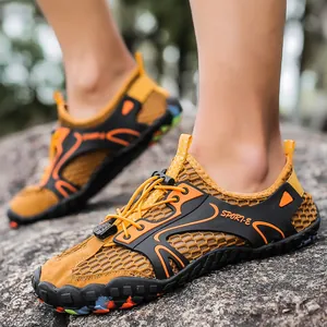 Professional breathable mesh men's outdoor climbing and hiking shoes on rocky terrain
