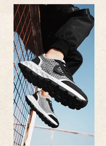 Low-angle view of designer men's sneakers with woven texture and chunky geometric sole