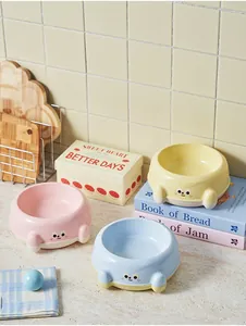Set of three cute cartoon pet bowls in pink, yellow, and blue pastel colors for cats and dogs