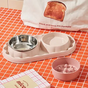 Durable pink stainless steel double pet bowl set featuring a slow feeder insert.