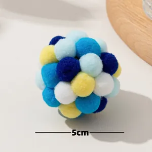 Close-up detail of a 5cm multi-color soft plush pom-pom ball for cat interactive play