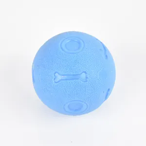 Detailed macro view of durable blue TPR dog toy ball featuring embossed bone patterns