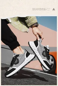 Close-up of men's casual woven work shoes with retro designer style in black and white.