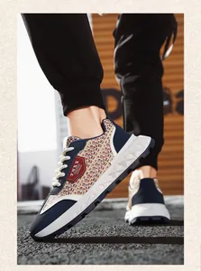 Detailed side view of men's retro casual sneakers with unique straw weave texture