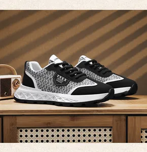 Detail view of retro men's sneakers with woven texture and white chunky diamond sole