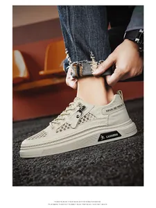 Macro view of breathable ivory mesh sneakers for men showing hollow-out texture details