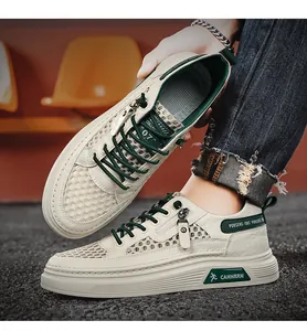 Detail of men's breathable cream and green mesh sneakers with hollow-out design