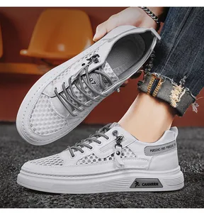 Macro view of white breathable mesh sneakers for men with unique side zipper detail