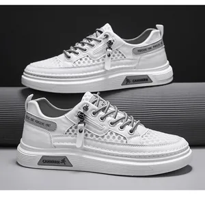 Close-up of white mesh hollow casual sneakers with zipper detail and grey accents.