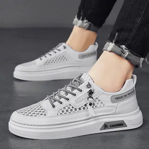 Breathable men's white mesh sneakers with a stylish hollow-out design and grey accents.