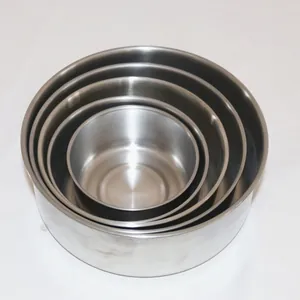 Set of four nesting stainless steel bowls for bird feeding and watering in cages.