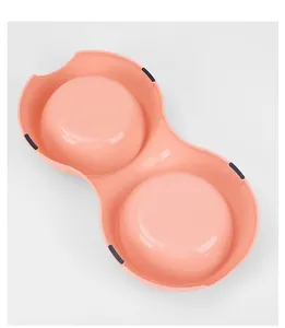Detailed top view of a pink double pet bowl with non-slip pads for cats and dogs