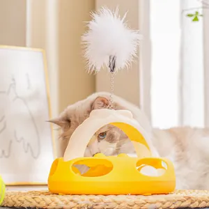 Gioco interattivo giallo per gatti con palline rotanti e una piuma a molla divertente