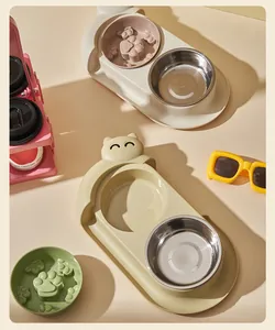 Detail of 15° tilted pet double bowl with stainless steel and slow feeder inserts.